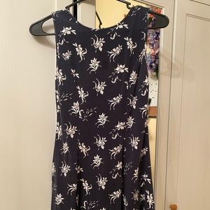 navy blue and white floral print sleeveless dress.